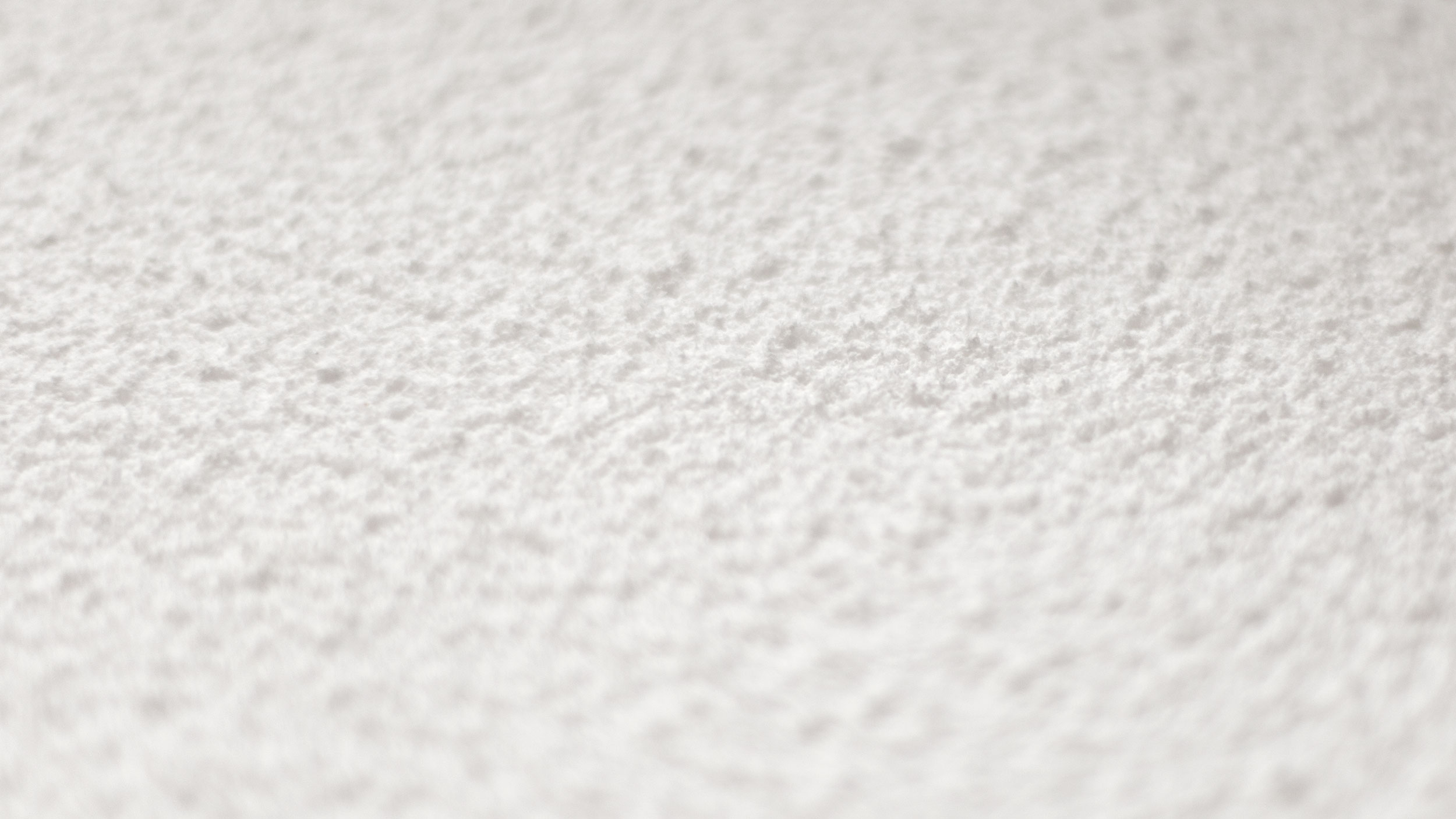 Close-up texture of Acosorb Acospray DC1 acoustic spray finish